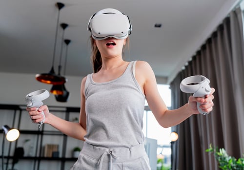 female-enjoy-3d-virtual-gaming-futuristic-experience-young-asian-female-wear-vr-headset-technology-watching-simulation-digital-world-hand-gesture-control-herself-to-beat-the-online-fun-virtual-gamingè